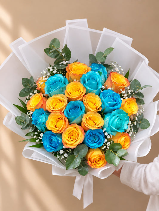Blue and orange roses bouquet with baby’s breath, eucalyptus and white wrapping in Dubai